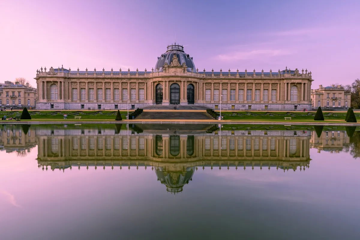 Versailles at dusk across the water